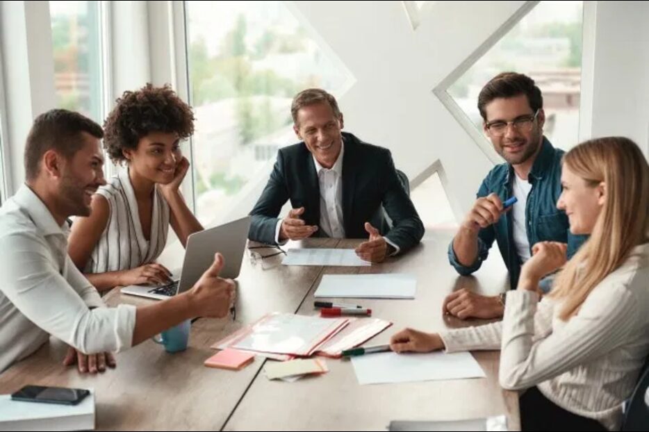 Team discussion around a meeting table